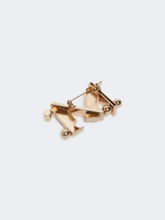 Broche métallique monogramme, dorée