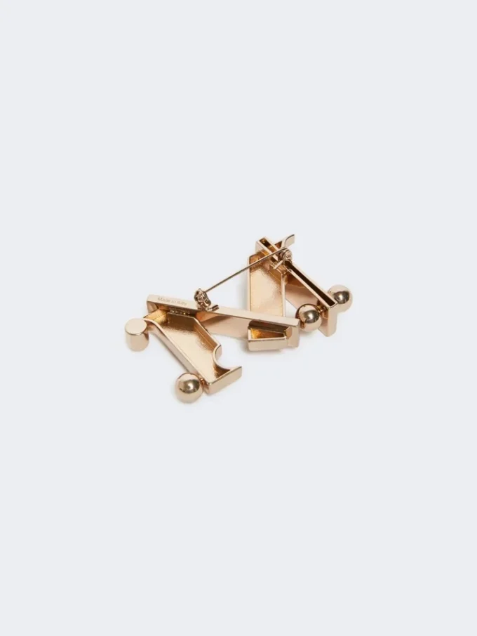 Broche métallique monogramme, dorée Broche métallique monogramme, dorée