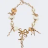 Collier ras-du-cou « Abissi » en métal et raphia, doré