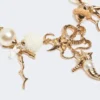 Collier ras-du-cou « Abissi » en métal et raphia, doré
