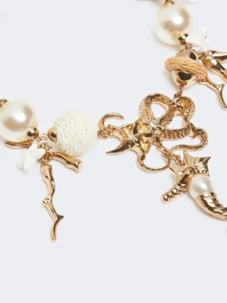 Collier ras-du-cou « Abissi » en métal et raphia, doré Collier ras-du-cou « Abissi » en métal et raphia, doré