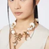 Collier ras-du-cou « Abissi » en métal et raphia, doré