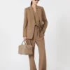 Polo en laine à côtes, beige doré et marron Polo en laine à côtes, beige doré et marron